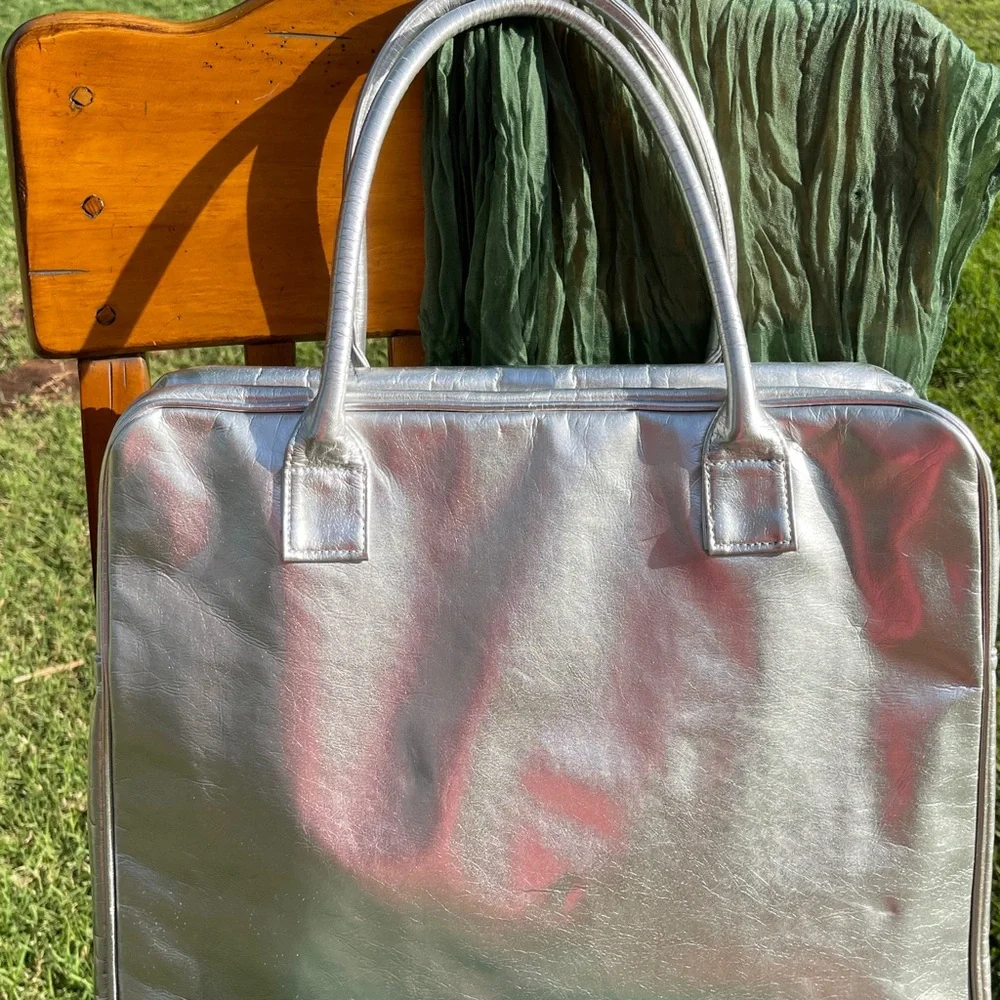 NWOT metallic silver laptop bag. Silver.    .